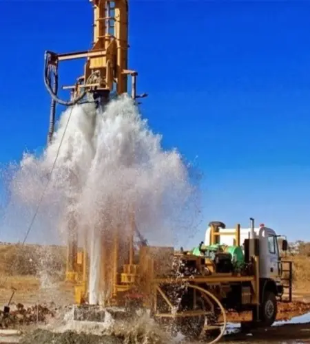 A drilling equipment that mists water into the air to clean the borehole and create a foggy layer.
